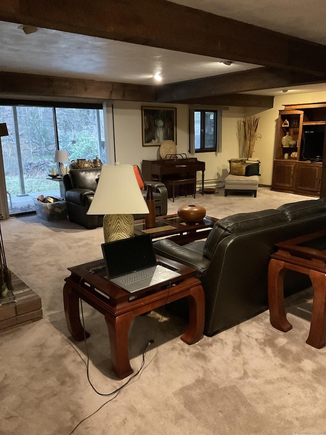 living room with beamed ceiling and light colored carpet