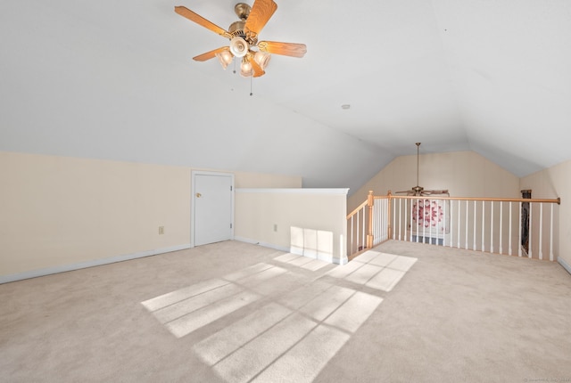 bonus room with ceiling fan, light carpet, and vaulted ceiling