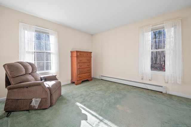 sitting room with light carpet and a baseboard heating unit