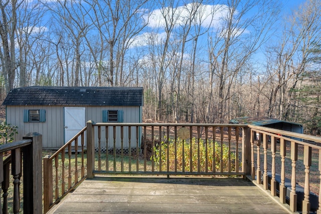 wooden deck with a storage shed