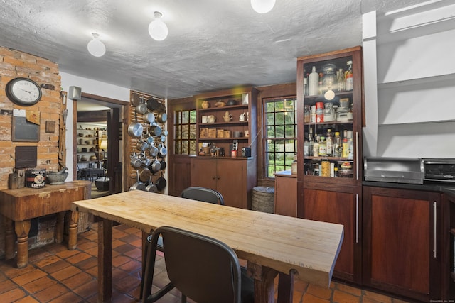 bar featuring a textured ceiling