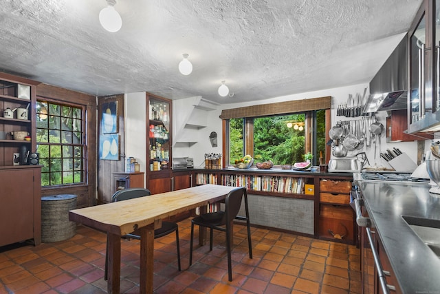 interior space featuring dark tile patterned flooring and a textured ceiling