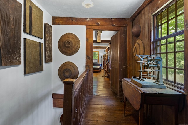 hallway with dark hardwood / wood-style floors