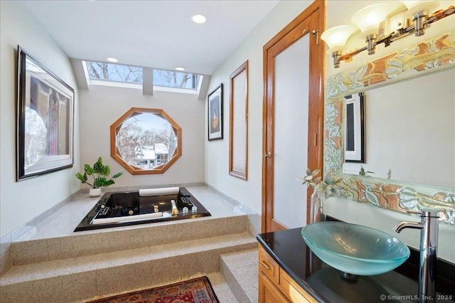 bathroom featuring a bathing tub and vanity