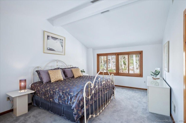 carpeted bedroom featuring beam ceiling and high vaulted ceiling