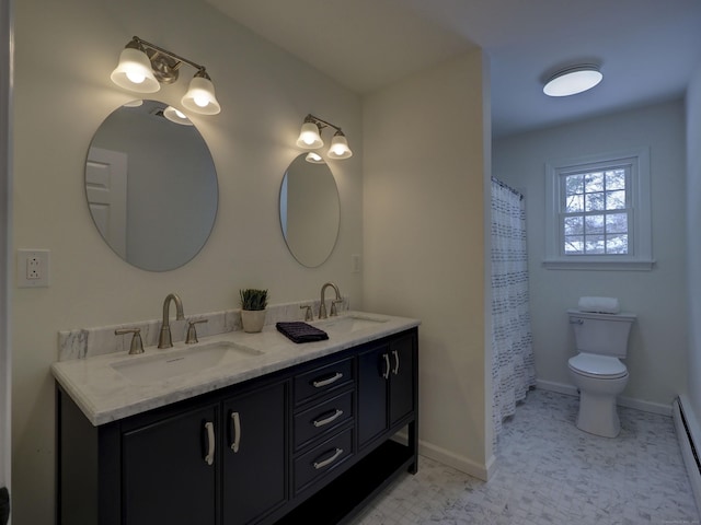 bathroom featuring vanity, a baseboard radiator, and toilet