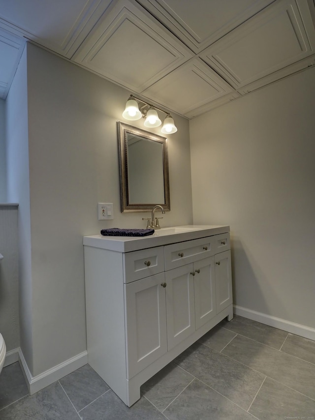 bathroom with tile patterned floors and vanity