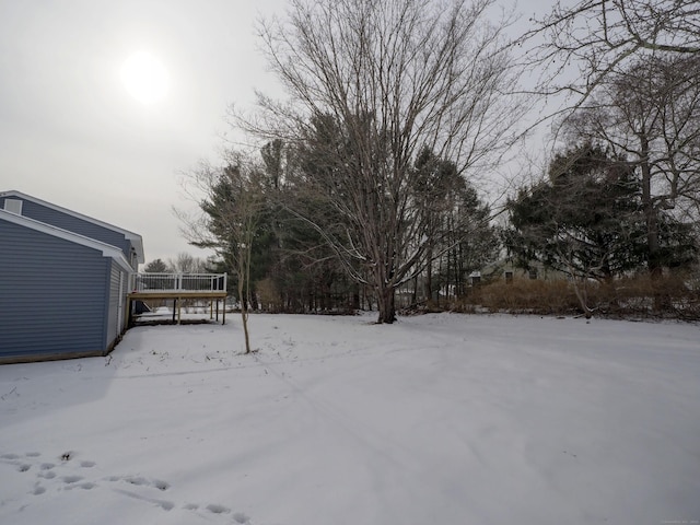 view of yard layered in snow