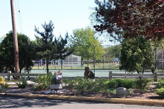 surrounding community featuring tennis court