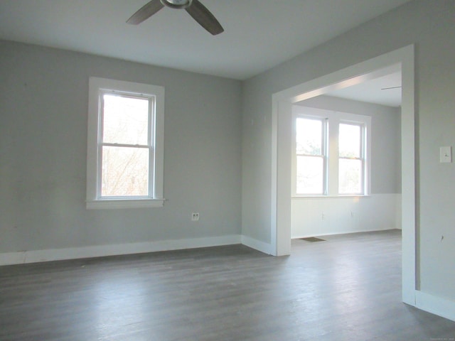 empty room featuring ceiling fan and wood-type flooring