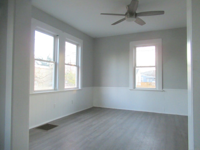 spare room with light hardwood / wood-style floors and ceiling fan