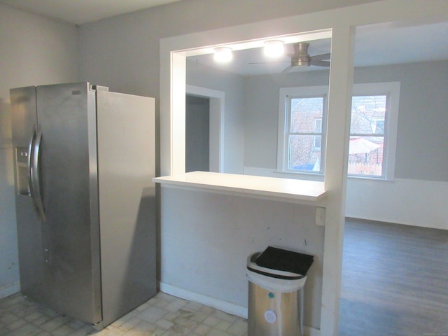 kitchen featuring stainless steel fridge with ice dispenser, light hardwood / wood-style flooring, and ceiling fan