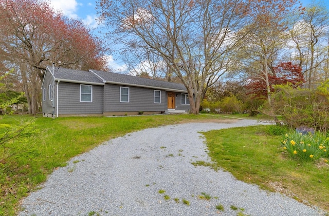 single story home with a front yard