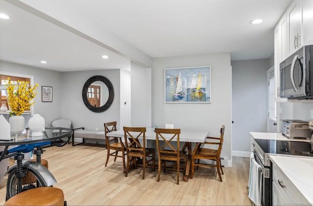 dining room featuring light hardwood / wood-style floors