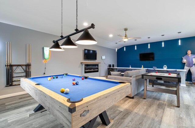 recreation room with hardwood / wood-style floors, ceiling fan, and pool table