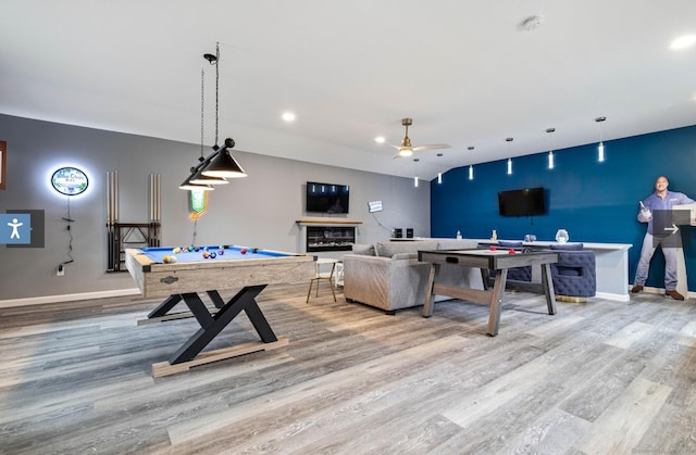 recreation room featuring ceiling fan, billiards, and hardwood / wood-style flooring