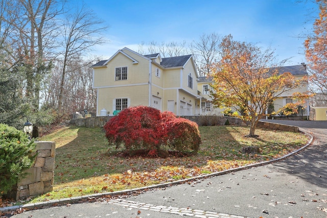 view of side of home with a garage