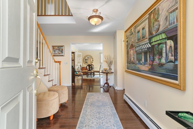 entryway featuring dark hardwood / wood-style flooring and a baseboard radiator