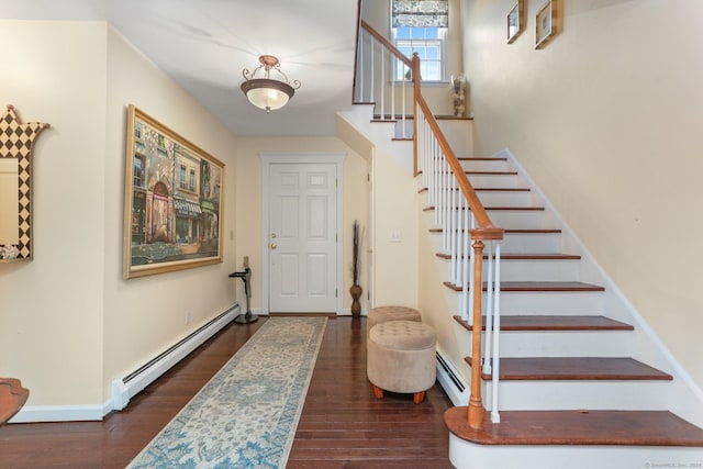 entrance foyer featuring baseboard heating and dark wood-type flooring