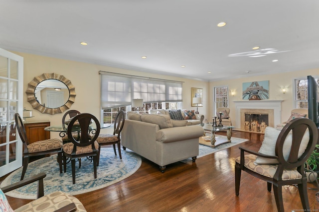 living room with crown molding and dark hardwood / wood-style floors