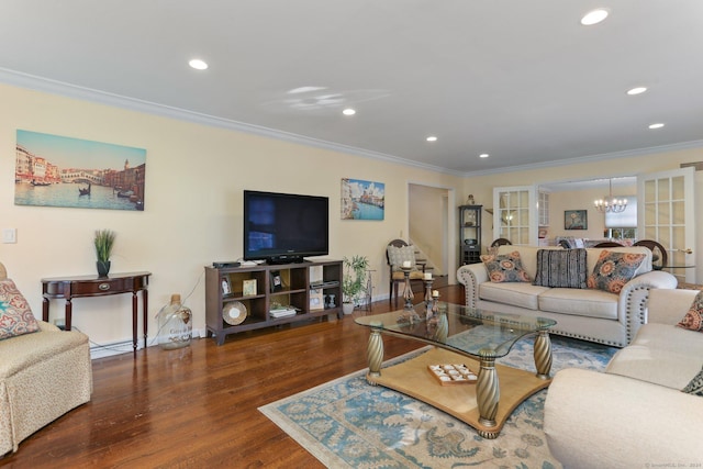 living room with dark hardwood / wood-style flooring, a chandelier, and ornamental molding