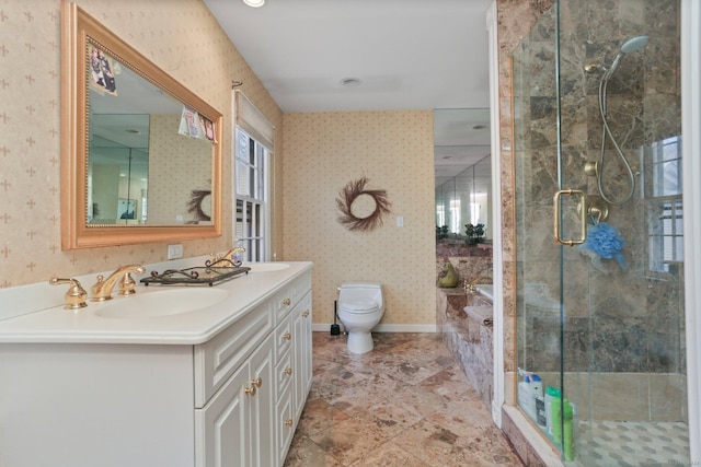 bathroom featuring tile patterned flooring, vanity, toilet, and a shower with shower door