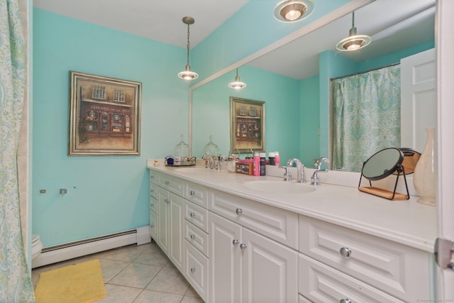 bathroom with baseboard heating, tile patterned floors, and vanity