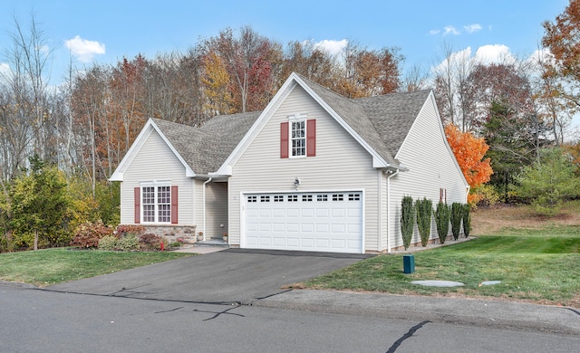 front of property featuring a garage and a front yard