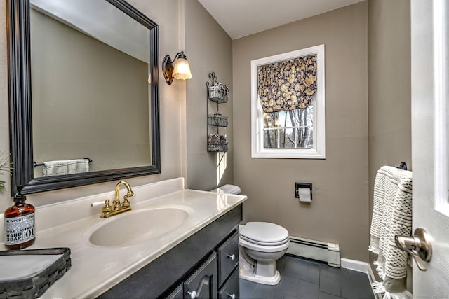 bathroom with a baseboard radiator, toilet, vanity, and tile patterned flooring