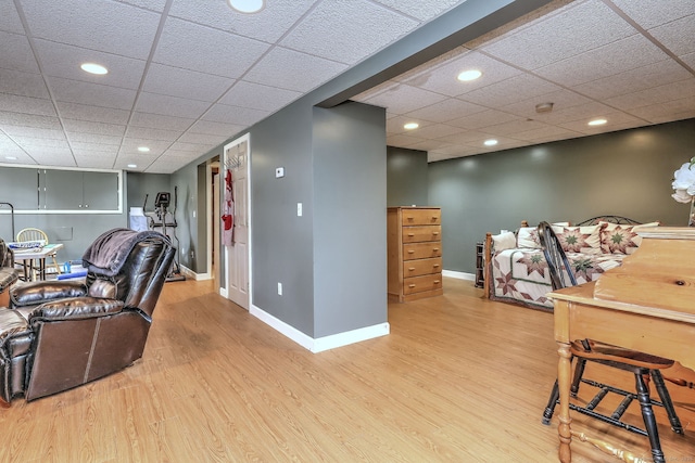 office area featuring wood-type flooring and a paneled ceiling