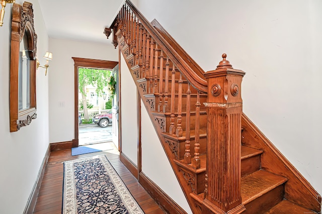 stairway featuring hardwood / wood-style floors