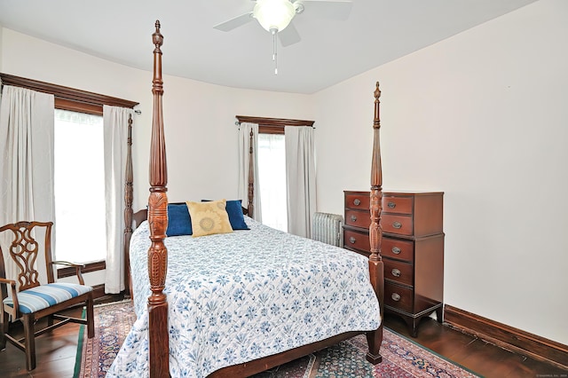 bedroom with dark hardwood / wood-style floors, multiple windows, and ceiling fan