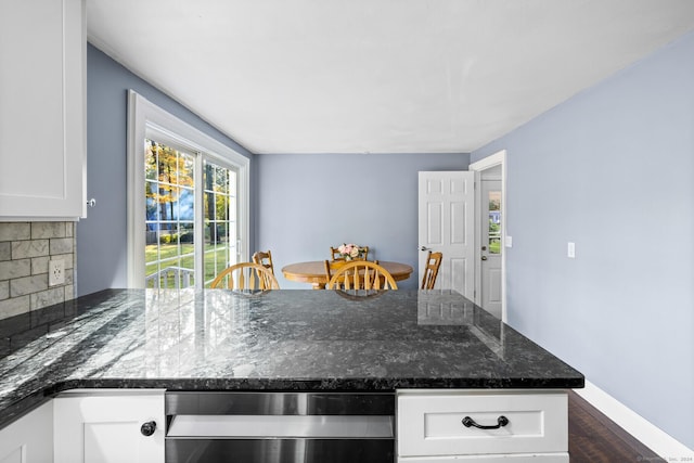 8 Fernwood Ave, Enfield, CT 06082 - kitchen with white cabinets, dark stone countertops, dark wood-style floors, dishwasher, and a peninsula