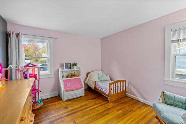 8 Fernwood Ave, Enfield, CT 06082 - bedroom with light wood-style floors and baseboard heating