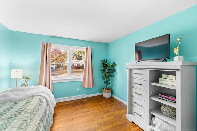 8 Fernwood Ave, Enfield, CT 06082 - bedroom with a baseboard radiator and light wood-style flooring
