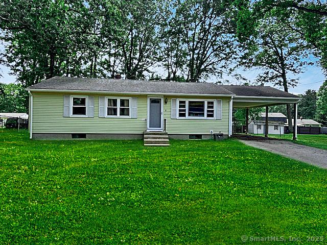8 Fernwood Ave, Enfield, CT 06082 - view of front of home featuring entry steps, driveway, a carport, and a front lawn
