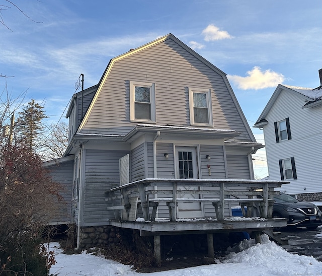 view of snow covered house