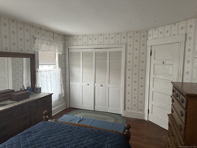 bedroom featuring dark hardwood / wood-style flooring and a closet