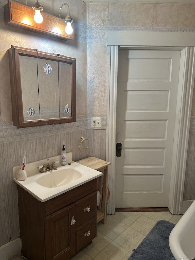 bathroom with vanity and a bathing tub