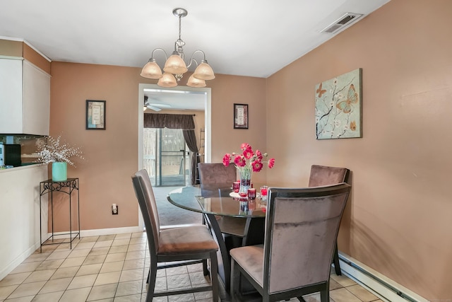 dining space featuring ceiling fan with notable chandelier, light tile patterned floors, and a baseboard heating unit