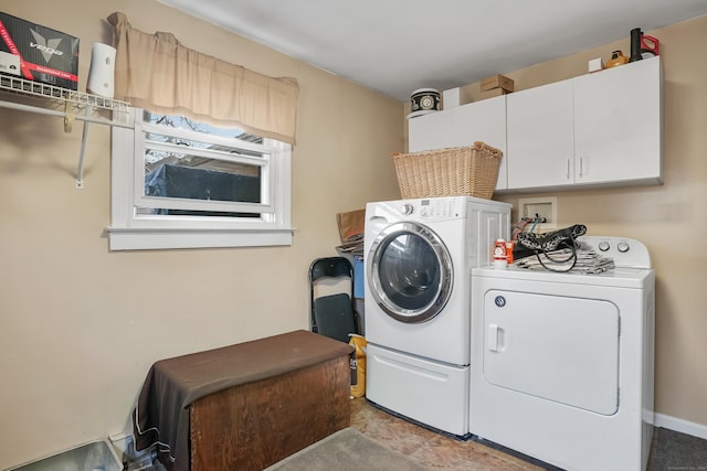 washroom with washing machine and dryer