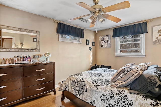 bedroom featuring ceiling fan and light wood-type flooring