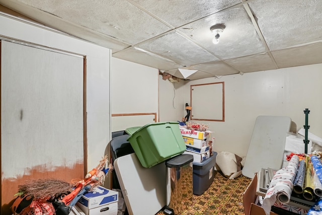 basement featuring a drop ceiling