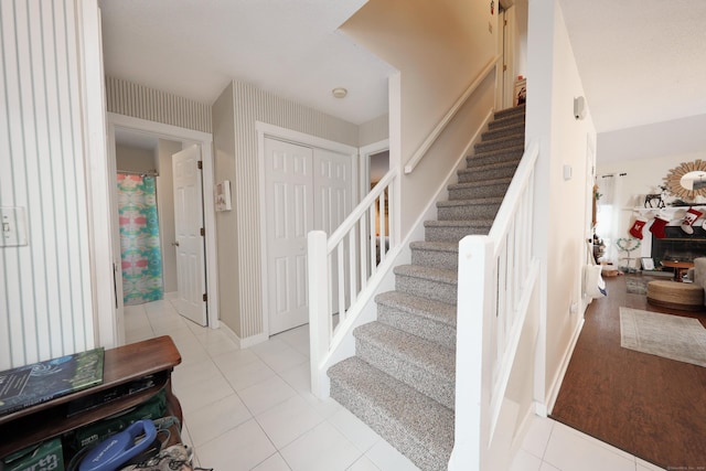 stairs featuring tile patterned floors