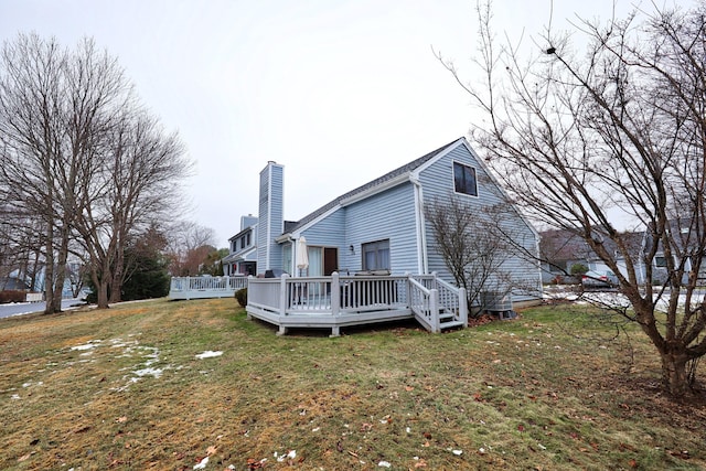 exterior space featuring a lawn and a wooden deck