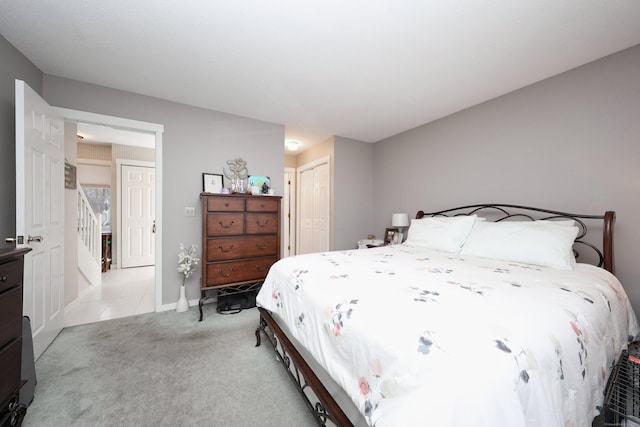 carpeted bedroom with a closet