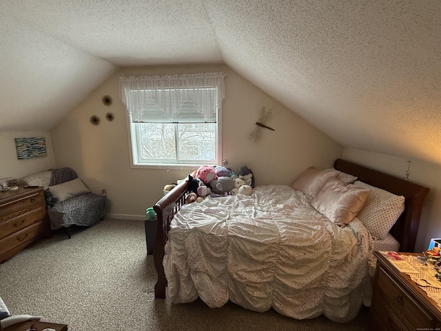 carpeted bedroom with lofted ceiling and a textured ceiling