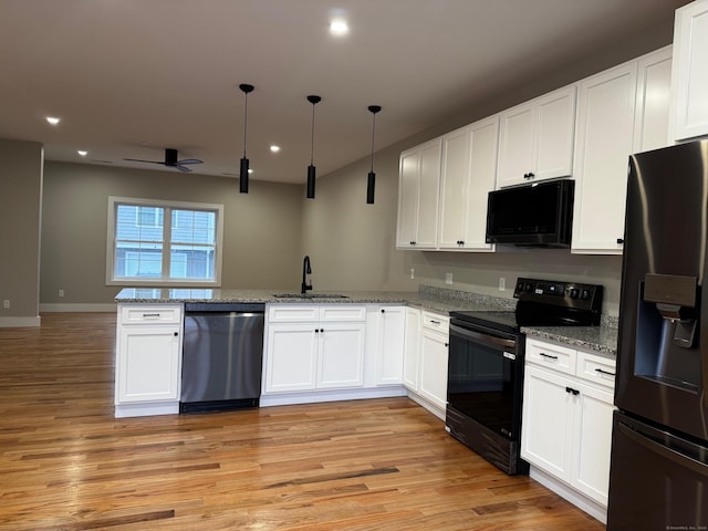 kitchen with ceiling fan, sink, black appliances, light hardwood / wood-style flooring, and white cabinetry