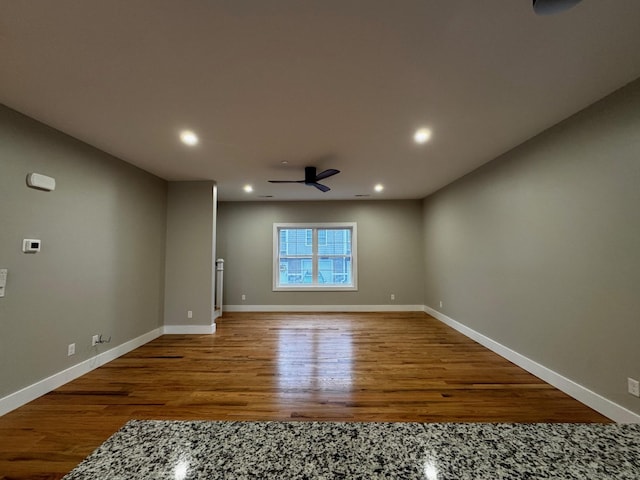 spare room featuring ceiling fan and hardwood / wood-style floors