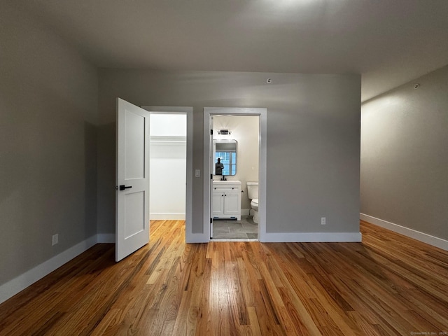 empty room with light hardwood / wood-style flooring